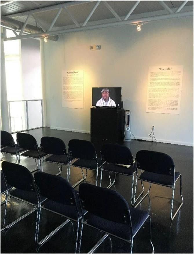 Figure 6 Educational space that replicates a classroom. The “Sandra Bland” plaque is to the left of the television, and “The Talk” is to the right. Author photo.